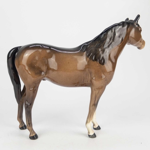 414 - A Beswick Pottery Palomino mare. Height 14cm, together with a Beswick Pottery horse both in gloss. (... 