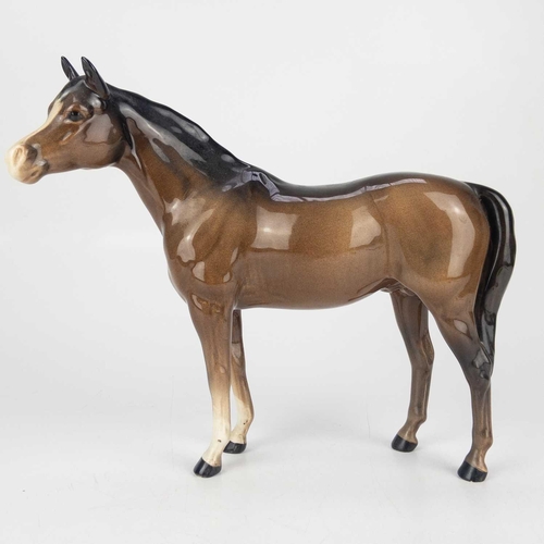 414 - A Beswick Pottery Palomino mare. Height 14cm, together with a Beswick Pottery horse both in gloss. (... 