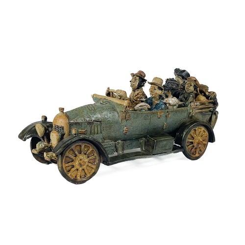 416 - A Charles D Forster pottery model of a car and family. Length 21cm; Together with several other stud... 