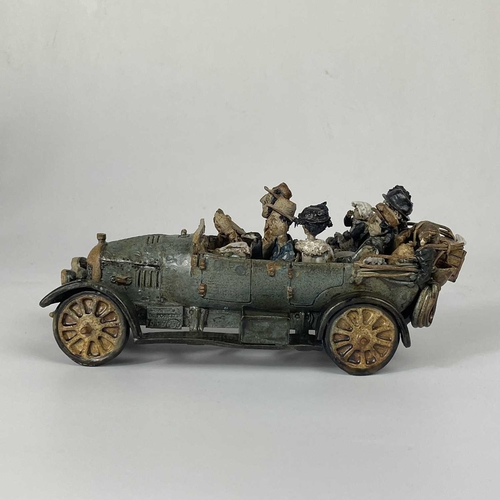 416 - A Charles D Forster pottery model of a car and family. Length 21cm; Together with several other stud... 