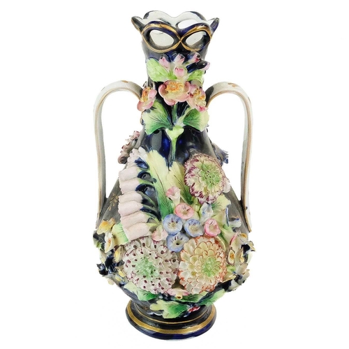 417 - A Coalbrookdale floral encrusted porcelain vase. With twin handles and a blue and gilt ground, heigh... 