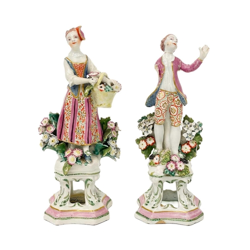 429 - A pair of Samson porcelain figures in Chelsea style. Modelled as a flower girl and companion with ps... 