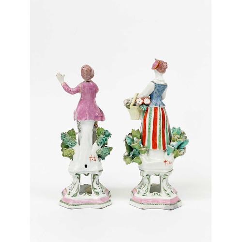 429 - A pair of Samson porcelain figures in Chelsea style. Modelled as a flower girl and companion with ps... 