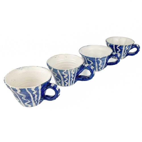 440 - Four Linda Craig studio pottery teacups. Height 6cm. (4)