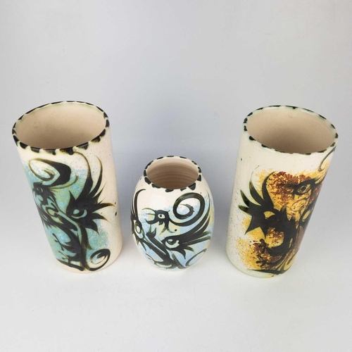 442 - Two Celtic Newlyn pottery cylindrical vases. Each painted with stylised birds, one with a label, hei... 