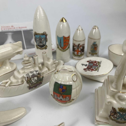 445 - A box of crested china. Including a Swan China airship, a Waterfall China E5 submarine, Arcadian tor... 