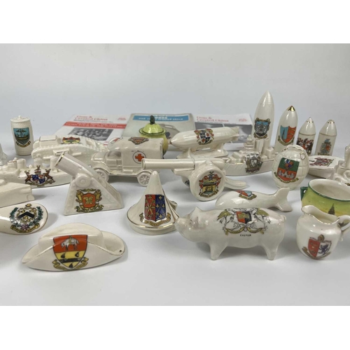 445 - A box of crested china. Including a Swan China airship, a Waterfall China E5 submarine, Arcadian tor... 