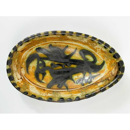 448 - A Celtic Newlyn Pottery Folksy dish. Length 17.5cm, together with a part Tintagel coffee service and... 