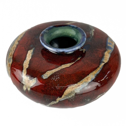 449 - A Cobridge Stoneware flambe glaze bottle vase. Height 15.5cm, together with another similar and a sq... 