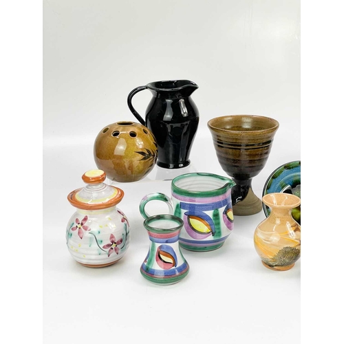 462 - A collection of studio pottery. To include, a studio pottery goblet with brown glaze, a collection o... 