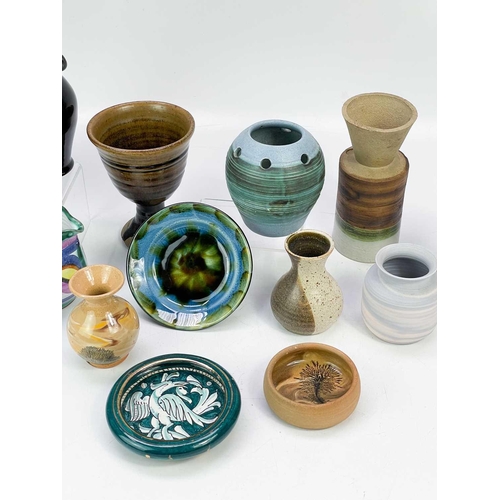 462 - A collection of studio pottery. To include, a studio pottery goblet with brown glaze, a collection o... 