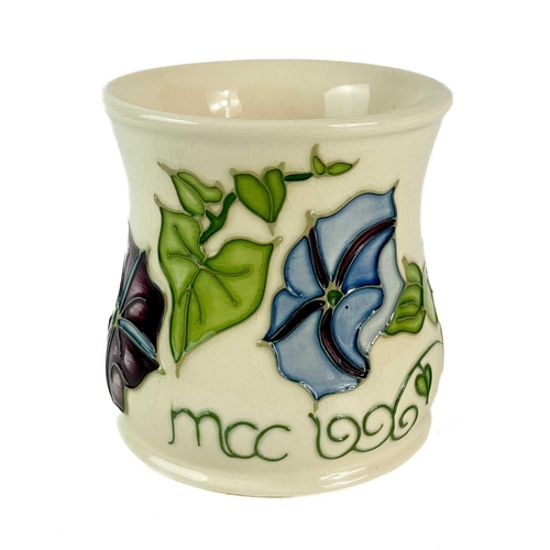 471 - A Moorcroft Pottery trial Morning Glory mug. Moorcroft Collector Club 1996, dated 18.1.1996 TRIAL to... 