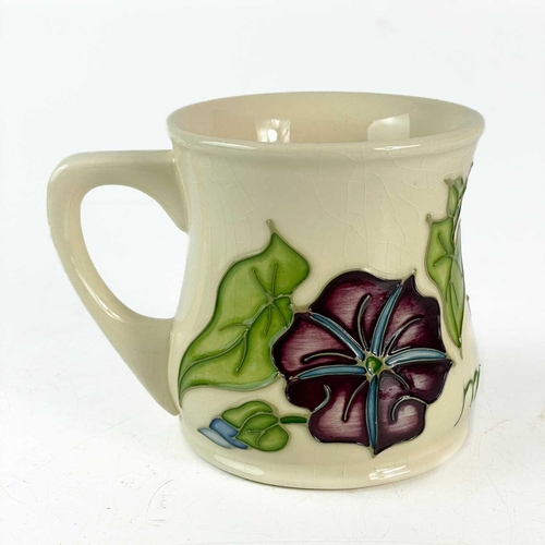 471 - A Moorcroft Pottery trial Morning Glory mug. Moorcroft Collector Club 1996, dated 18.1.1996 TRIAL to... 