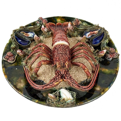 474 - A Portuguese Palissy style lobster dish. Diameter 33cm, together with a large shop display glass dec... 