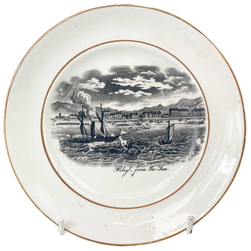 486 - A Victorian bone china child's part tea set. Each printed in black with titled views of 'Rhyl from t... 