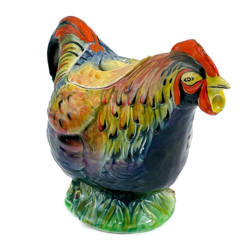 491 - A Wilkinson pottery Indian Summer pattern charger. Diameter 34cm together with a mid century Rooster... 