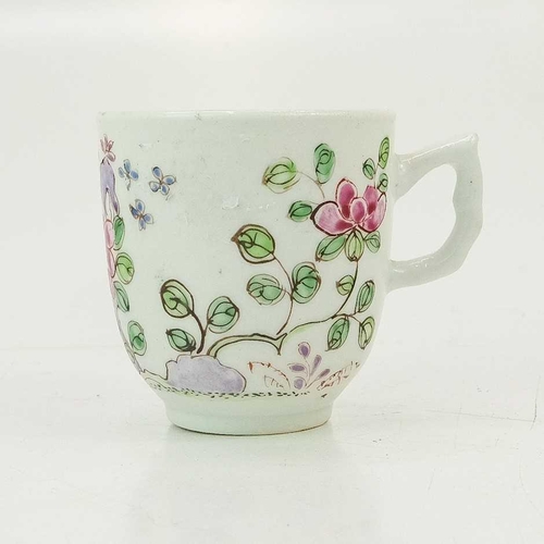 497 - An early Bow coffee cup. Painted in a Famille Rose pallette with a flowering peony, height 6cm.