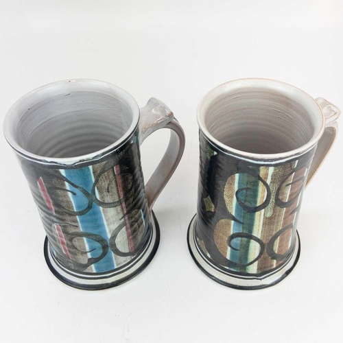 504 - Two Aldermaston pottery mugs. Height 14.5cm, together with an Aldermaston vase, height 14cm, possibl... 