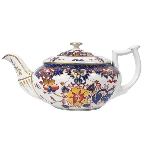 505 - A Bloor Derby circular porcelain teapot and cover. Circa 1820, painted and gilt in the Imari palette... 