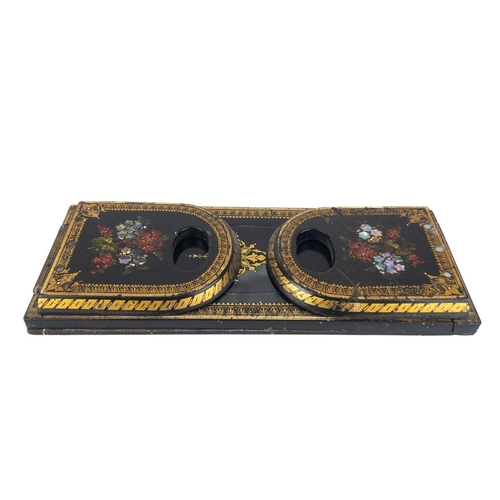 51 - A Victorian papier mache lacquer book slide. Decorated with flowers and inset with mother of pearl, ... 