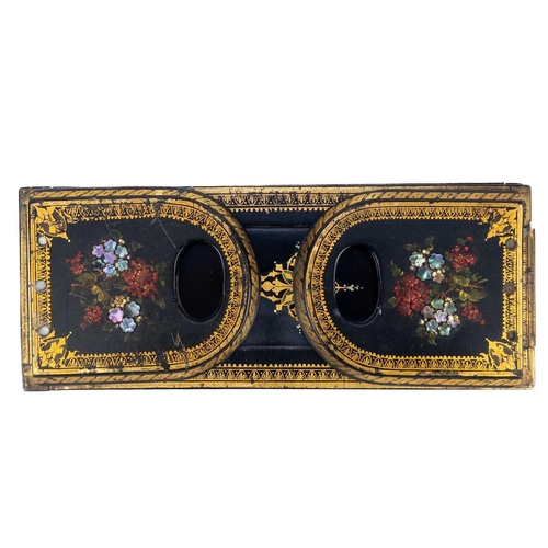 51 - A Victorian papier mache lacquer book slide. Decorated with flowers and inset with mother of pearl, ... 