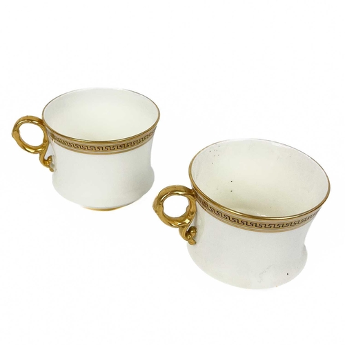 510 - A collection of gilt Greek Key banded coffee and dinnerware. Comprising eight Hammersley cups and sa... 