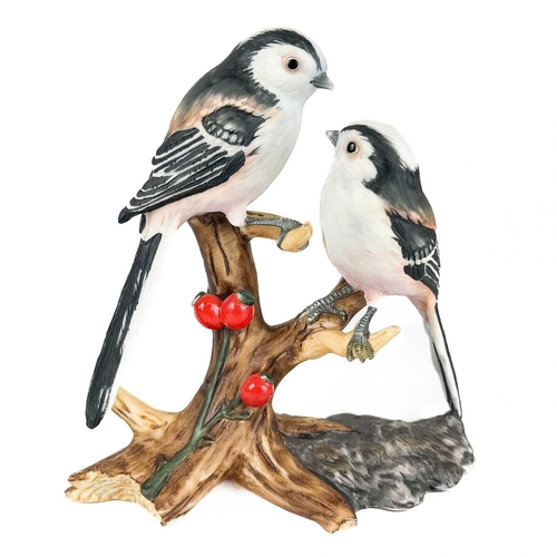 512 - A collection of hand painted ceramic birds. To include a Mack pottery long tailed tit, a classic ros... 