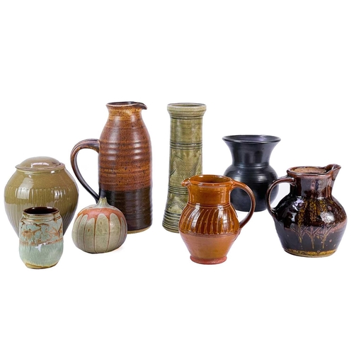 518 - A collection of studio pottery. To include; A Wellcombe pottery jug, height 29cm, A large studio pot... 