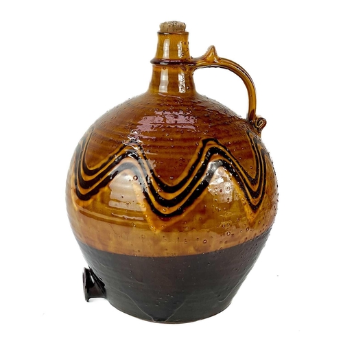 523 - A Harry Juniper studio pottery flagon. In a brown glaze with trailed slip decoration, Height 33cm.