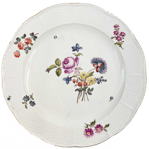 527 - A Meissen porcelain plate. 18th century, with ozier moulded border and floral painted decoration, pa... 