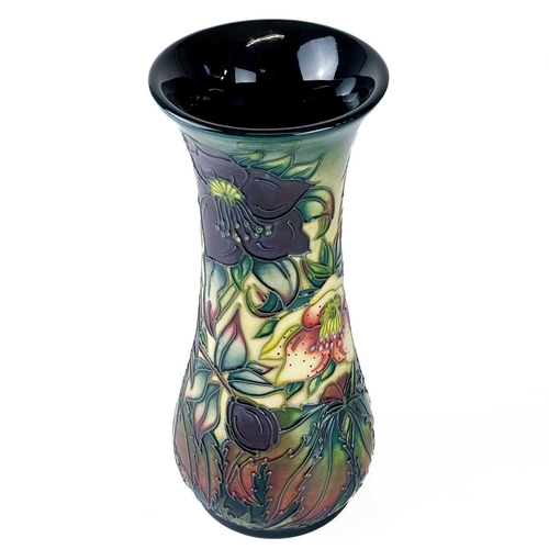 529 - A Moorcroft Pottery Ashwood Hellebore vase by Nicola Slaney. Painters initials H B (Heather Bettany)... 