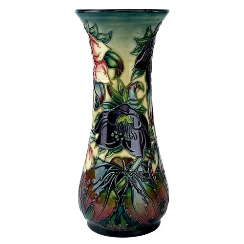 529 - A Moorcroft Pottery Ashwood Hellebore vase by Nicola Slaney. Painters initials H B (Heather Bettany)... 