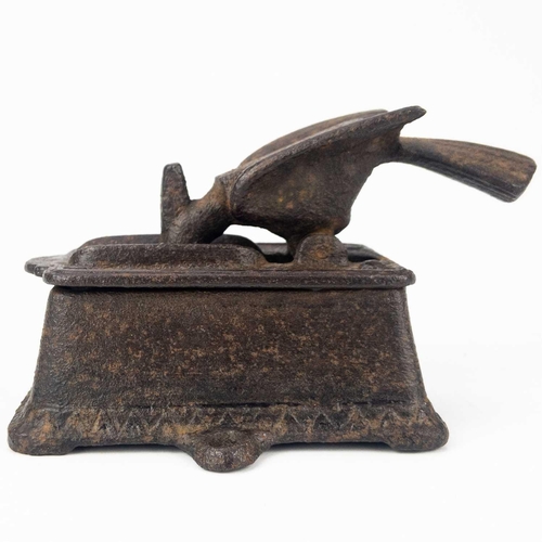 53 - An American cast iron bar top bird match dispenser. Pivoted, and the beak designed to spear the matc... 