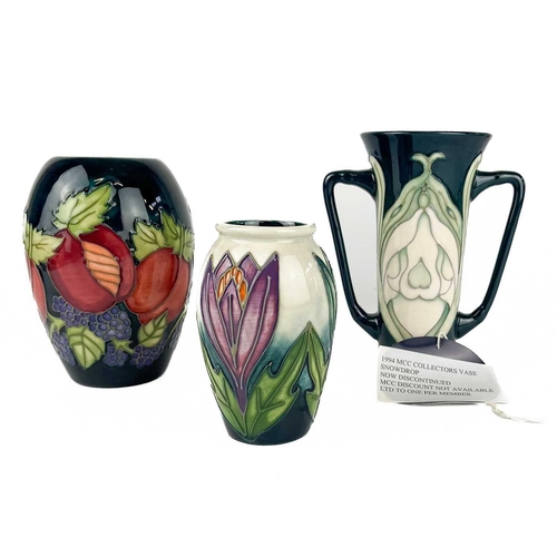 533 - A Moorcroft Pottery Snowdrop twin handled vase. M.C.C marks, height 15cm, together with a Moorcroft ... 