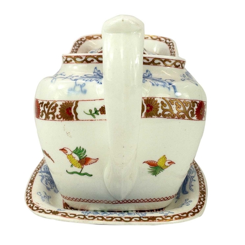 545 - A Spode teapot, cover and stand. Circa 1815, with underglaze blue, polychrome and gilt decoration, p... 