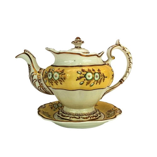 557 - A Derby fluted oval teapot and cover. Circa 1800, with yellow painted border and gilt ornament, heig... 