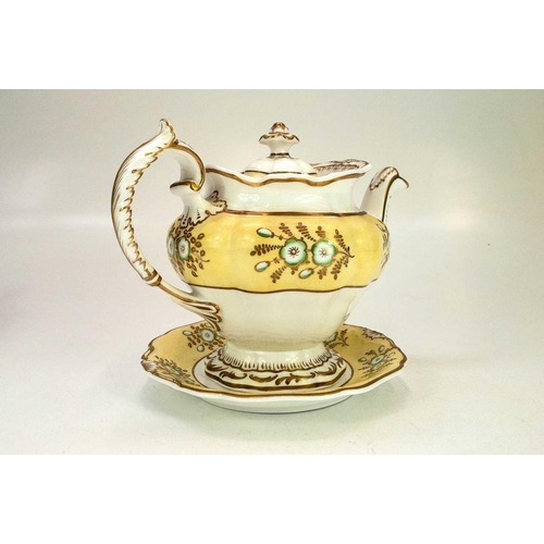 557 - A Derby fluted oval teapot and cover. Circa 1800, with yellow painted border and gilt ornament, heig... 