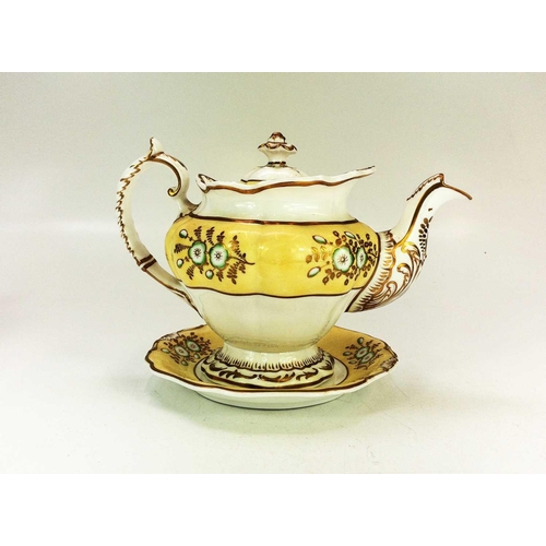 557 - A Derby fluted oval teapot and cover. Circa 1800, with yellow painted border and gilt ornament, heig... 