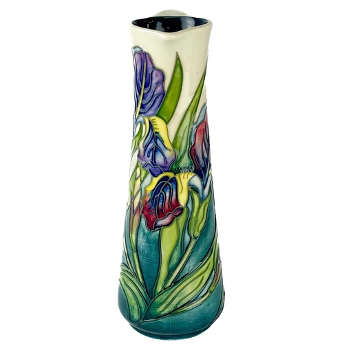 559 - A Moorcroft Pottery Bishop Iris jug by Rachel Bishop. M.C.C marks, height 24cm. Typical crazing, but... 