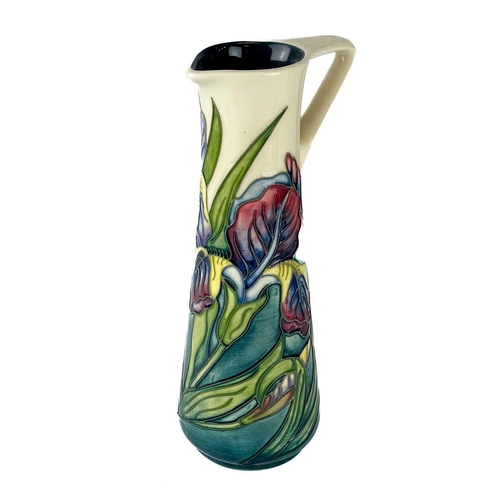 559 - A Moorcroft Pottery Bishop Iris jug by Rachel Bishop. M.C.C marks, height 24cm. Typical crazing, but... 