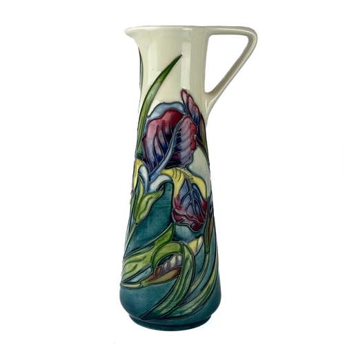 559 - A Moorcroft Pottery Bishop Iris jug by Rachel Bishop. M.C.C marks, height 24cm. Typical crazing, but... 