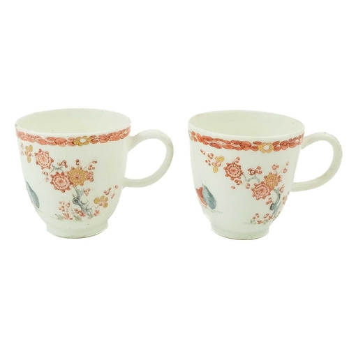 560 - A pair of Bow Kakiemon palette two Quail pattern coffee cups. Of diminutive size, height 5.5cm.