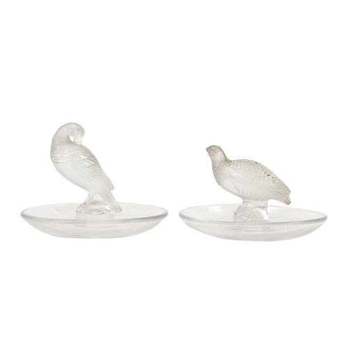 562 - A Lalique glass pin tray with a Quail. Signed Lalique France diameter 9.5cm, together with another L... 