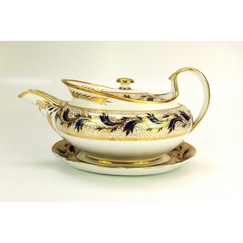 566 - A New Hall or Keeling oval porcelain teapot, cover, and stand. Circa 1800, with flower painted and g... 