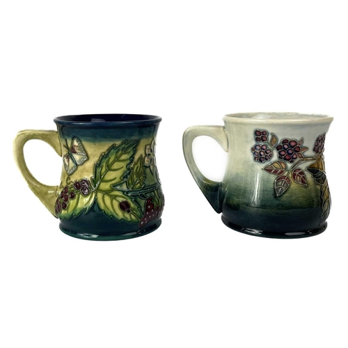 578 - A collection of seven Moorcroft Pottery mugs. Including a Moorcroft Collectors Club 1998 example tog... 