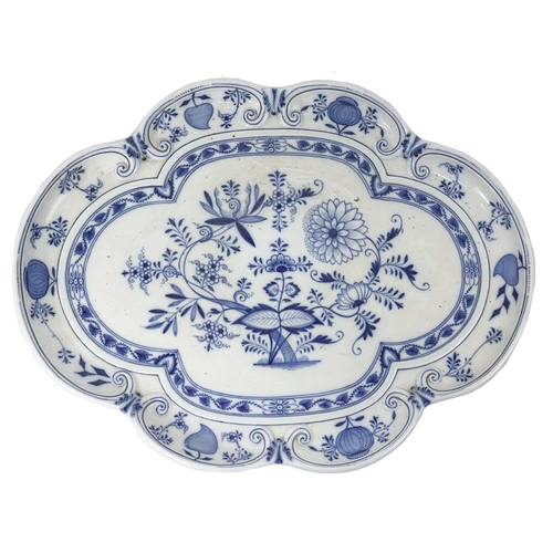 581 - A Meissen onion pattern blue and white serving tray. Of lobed shape, cancelled crossed swords mark, ... 