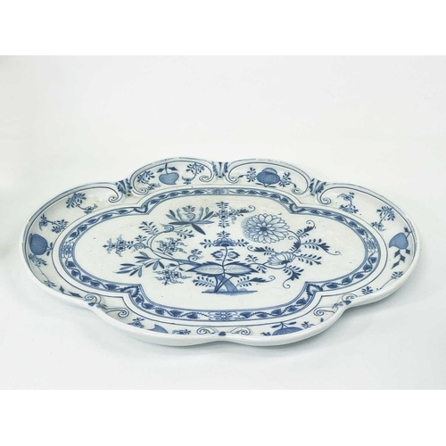 581 - A Meissen onion pattern blue and white serving tray. Of lobed shape, cancelled crossed swords mark, ... 