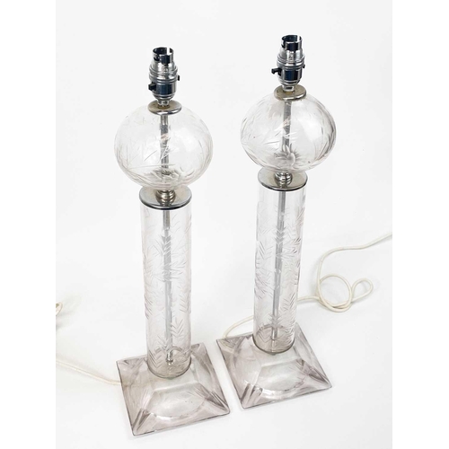 585 - A pair of mid 20th century French glass table lamps. With etched floral decoration, height 56cm.