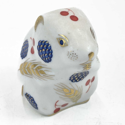 587 - A Royal Crown Derby porcelain Harbour Seal paperweight. With stopper, together with six other Royal ... 