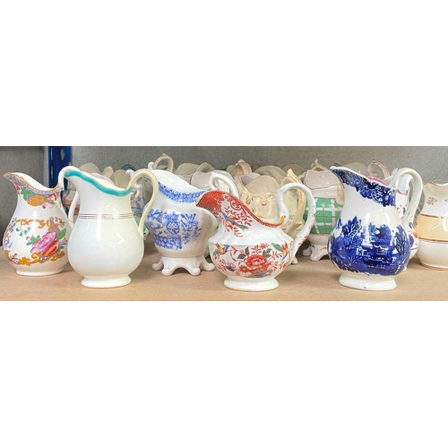 590 - A vast collection of approximately 95 milk and cream jugs. Mainly Victorian, in an array of shapes, ... 